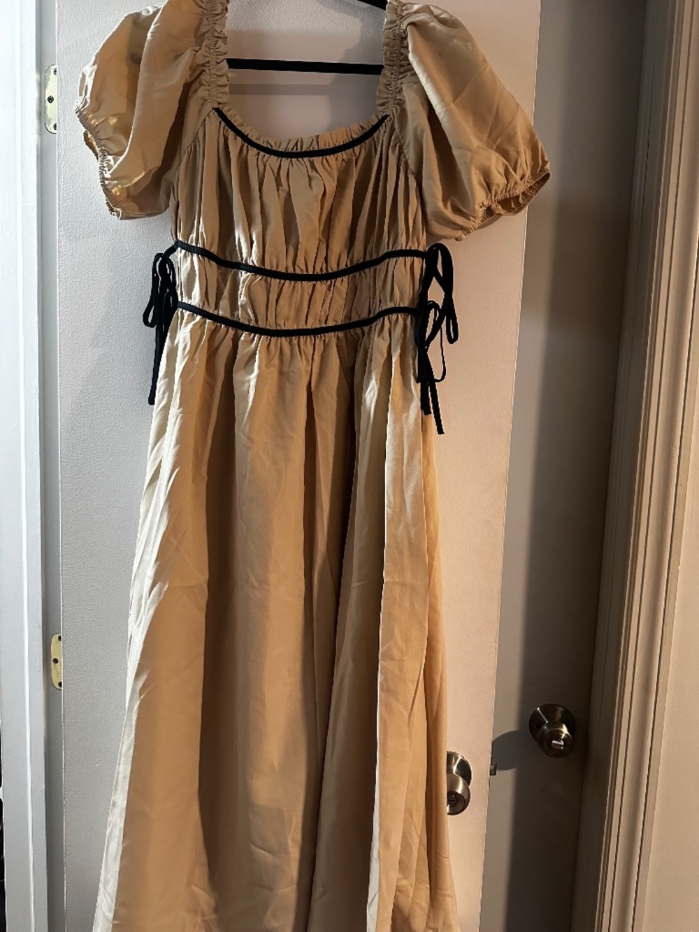Tan dress with black bows